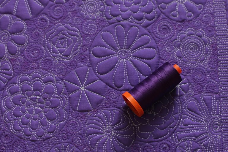 Purple quilted fabric with purple spool