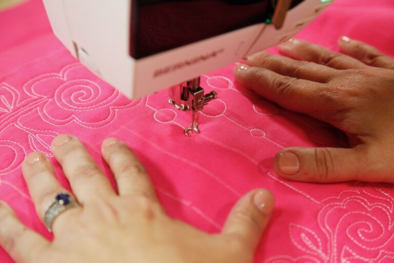 Closeup of hands using a sewing machine